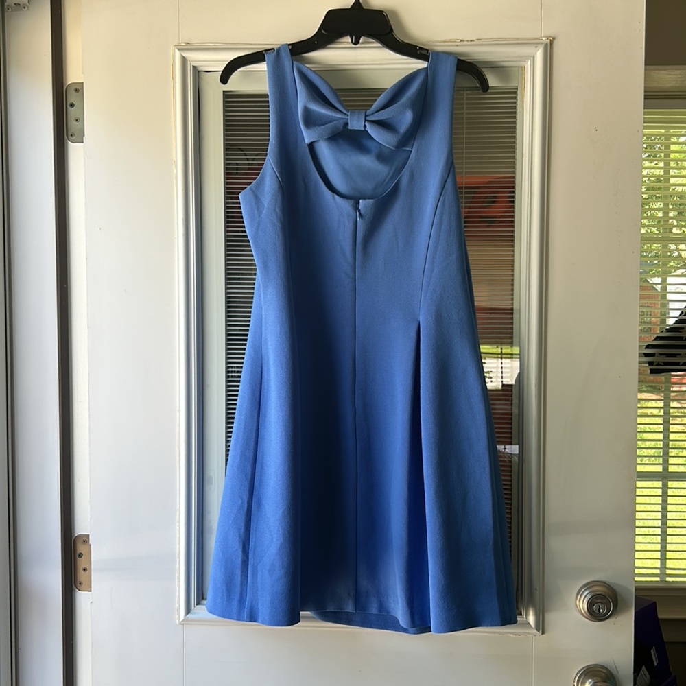 Beautiful fully lined A-line dress with a bow detail on the back,  polyester